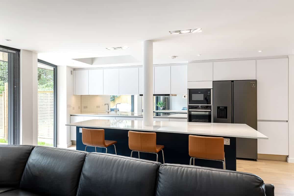 White Handleless Kitchen with dark island