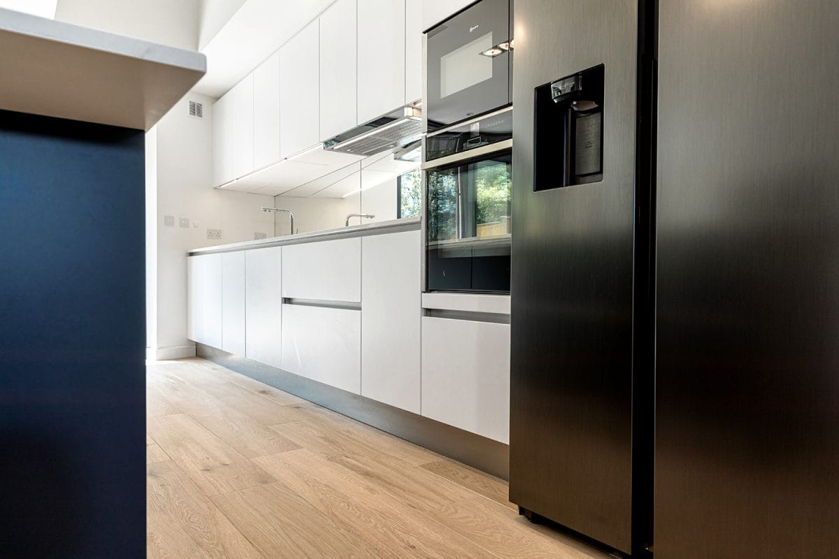 White Handleless Kitchen with appliances