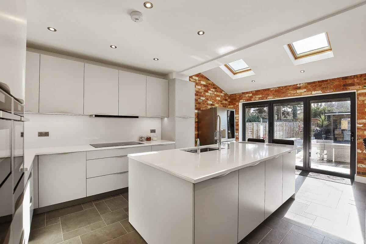 All white modern kitchen with island