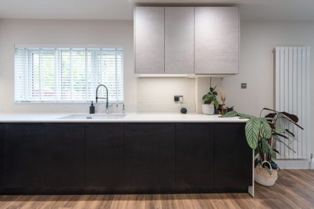 Sophisticated Nolte Kitchen with White Concrete and Black Ash