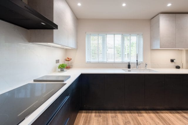 Sophisticated Nolte Kitchen with White Concrete and Black Ash