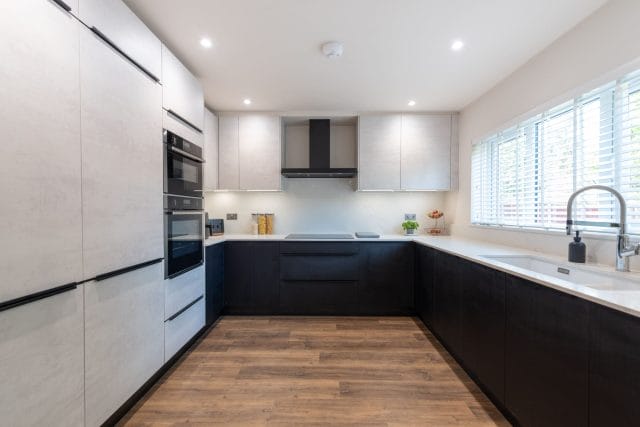 Sophisticated Nolte Kitchen with White Concrete and Black Ash