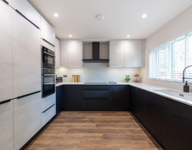 Sophisticated Nolte Kitchen with White Concrete and Black Ash