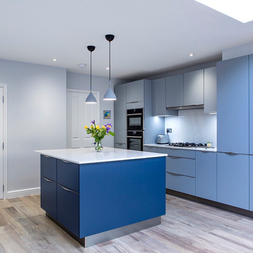 Modern Light Blue Kitchen with dark blue island